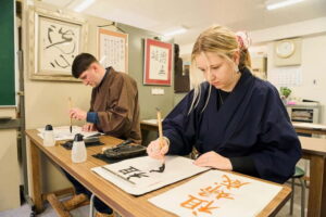 Tokyo: Calligraphy Workshop & Original T-Shirt Creation - From FamilyMart to workwear: how the 2-hour session usually runs