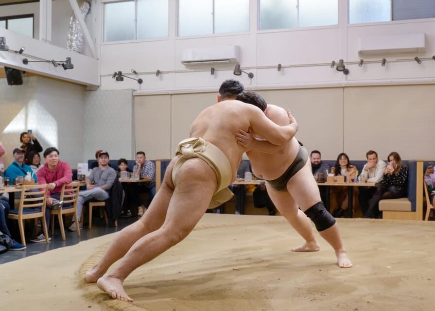 Tokyo: Challenge Sumo Wrestlers and Enjoy Meal - The hands-on part: costume on, moves tried, laughs guaranteed