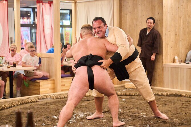 TokyoSumoShow, ChickenHotPot, and Mochi-Pounding by Pro Wrestlers - Mochi pounding challenge: fun for kids, with real participation limits