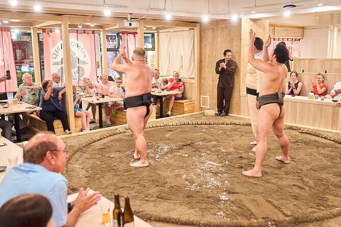 TokyoSumoShow, ChickenHotPot, and Mochi-Pounding by Pro Wrestlers - Sumo bout challenge: stepping into the ring moment (carefully)